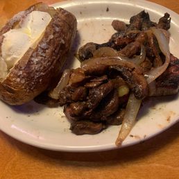 6oz steak with mushrooms with onions, baked potato delicious. 6oz steak with mushrooms with onions, baked potato delicious.