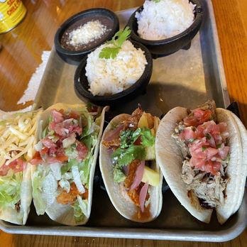 Hombre y Lobo | Tacos + Tequila - Left to right: CHORIZO, BUFFALO CHICKEN, SHRIMP, CARNITAS - Tacos Near Me - Buffalo, New York
