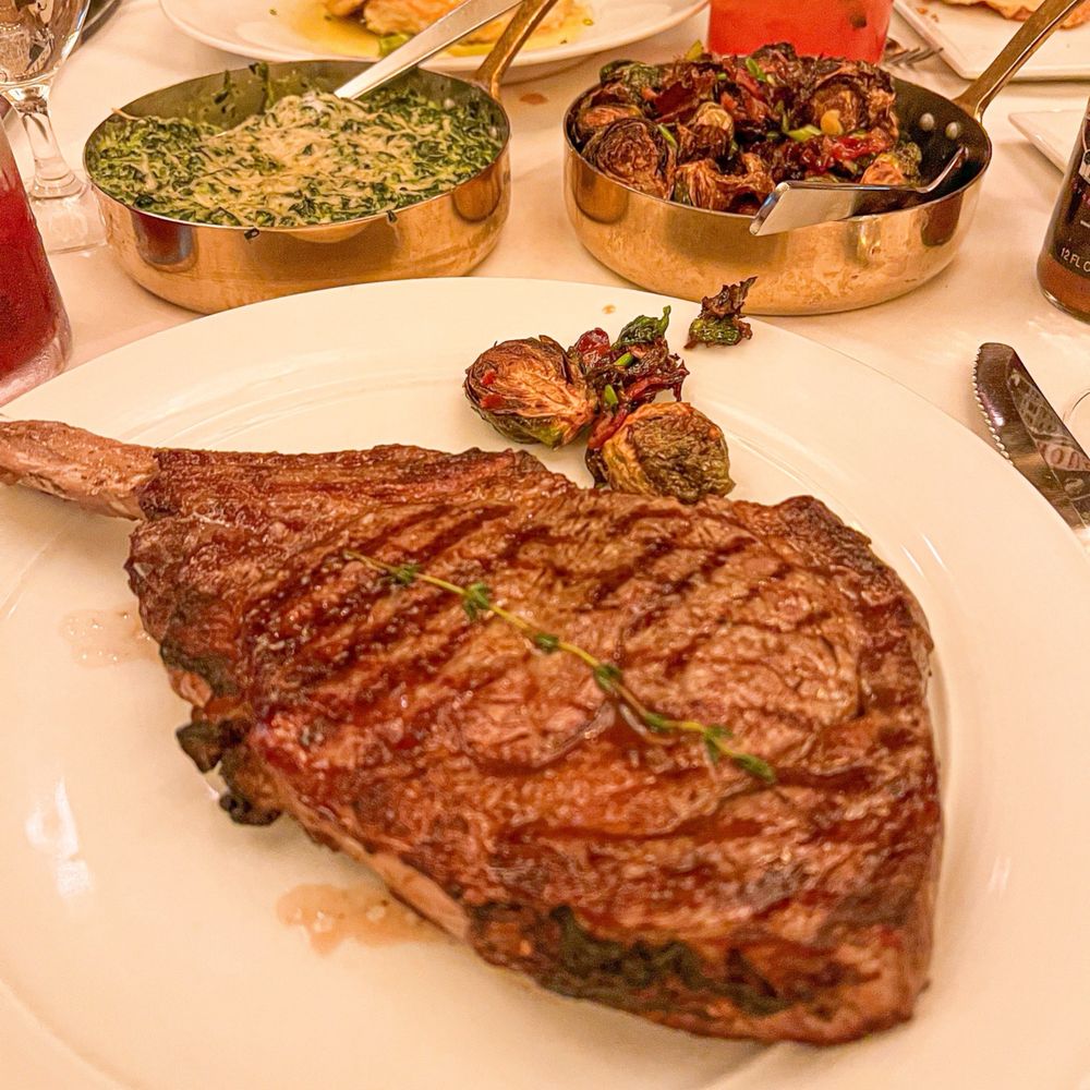 Roots Steakhouse - Prime Cowboy Steak with creamed spinach and roasted mushrooms - Steakhouses Near Me - Ridgewood, New Jersey