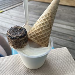 Small Wedding Cake sundae that is topped with a cone and a warm marshmallow Small Wedding Cake sundae that is topped with a cone and a warm marshmallow