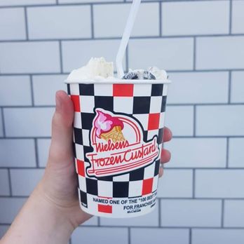 Nielsen's Frozen Custard - a hand holding a cup of ice cream - Ice Cream & Frozen Yogurt Near Me - Bountiful, Utah