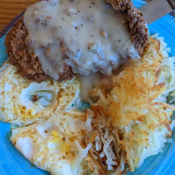 Marina Variety Store Restaurant - Country Steak with sausage gravy, much bigger than the photo. Chose hash browns or grits with the side of either toast or a biscuit. - Seafood Near Me - Charleston, South Carolina