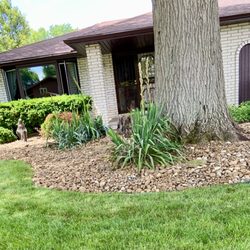 H and A Landscaping Construction - River Rock added to replace mulch.