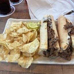 Cheesesteak and chips. Cheesesteak and chips.