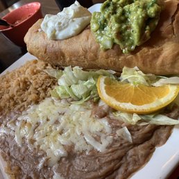 Chimichanga with chile verde inside. Rice & beans, chips & salsa. Chimichanga with chile verde inside. Rice & beans, chips & salsa.