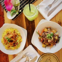 Café Basa - (Left) Asian-glazed Calamare w/ turmeric rice & (Right) Peppered beef with buttered rosemary potato