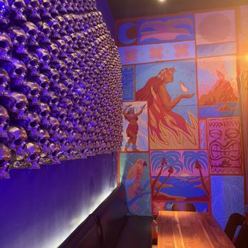 Mai Tiki - Dining area and the scull wall - Tiki Bars Near Me - Ferndale, Michigan