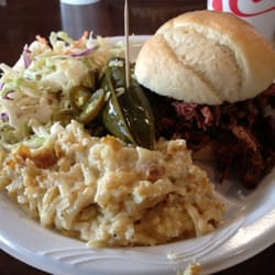 Lonnie Q's BBQ - Brisket sandwich with coleslaw, cheesy potatoes, jalapeños and a pickle spear all for 8.95!