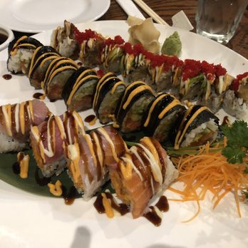 Dozo - Black spider (back), volcano (middle), and rainbow mix sushi rolls - Japanese Near Me - New Haven, Connecticut