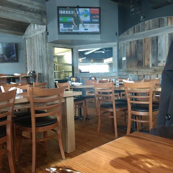 Kenzington Burger Bar - wooden tables and chairs - Burgers Near Me - Barrie, Ontario