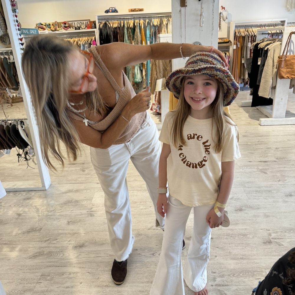 Mora Surf Boutique - One of the owners, Claudia, making my daughter feel so important! - Accessories Near Me - Deerfield Beach, Florida Mora Surf Boutique - One of the owners, Claudia, making my daughter feel so important! - Accessories Near Me - Deerfield Beach, Florida
