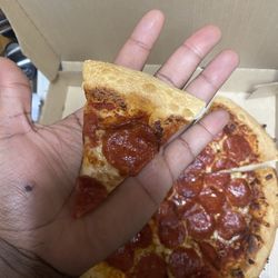 Pizza Hut - Carelessly sliced pizza.