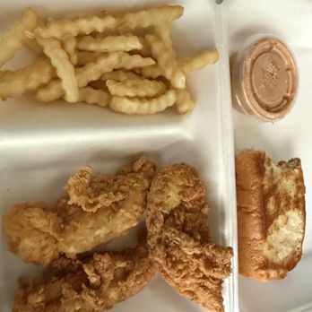 Raising Cane's Chicken Fingers - The whole combo in general excuse the bite out of the bread - Fast Food Near Me - Round Rock, Texas