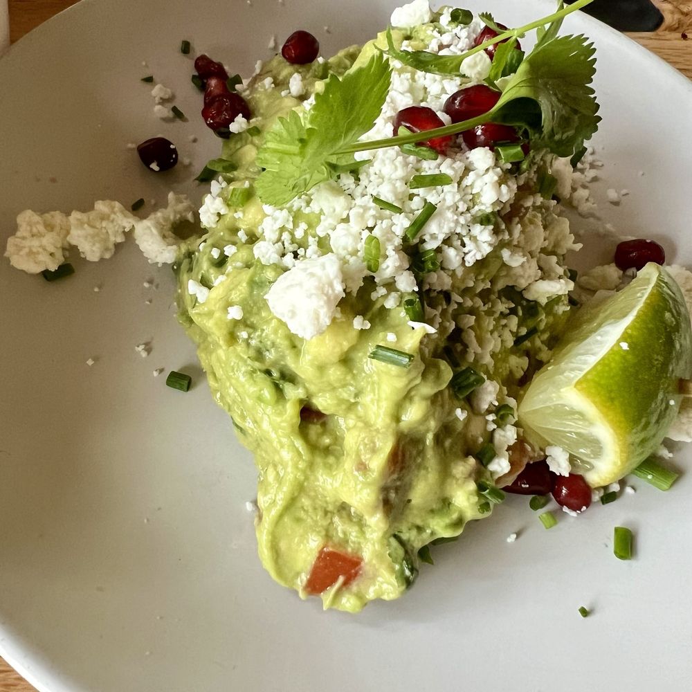 Mole Mexican Kitchen - Fabulous guacamole with little bits of not spicy but flavorful bits jalapeños topped with pomegranate. Very Mexico City style - Mexican Near Me - Palm Desert, California Mole Mexican Kitchen - Fabulous guacamole with little bits of not spicy but flavorful bits jalapeños topped with pomegranate. Very Mexico City style - Mexican Near Me - Palm Desert, California