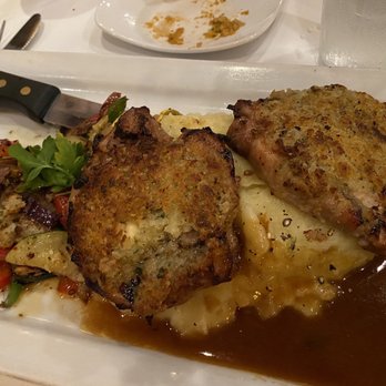 Lugano Ristorante - Pork chops over mashed potatoes with veggies - Italian Near Me - Cary, North Carolina Lugano Ristorante - Pork chops over mashed potatoes with veggies - Italian Near Me - Cary, North Carolina
