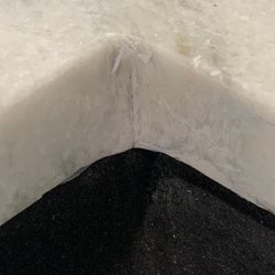 Elite Home & Stone Supply - The granite was cut roughly and they tried to "fix it" with putty; shoddy work.