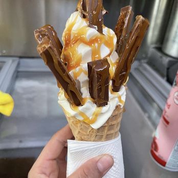 Batman Ice Cream And Corn - a hand holding an ice cream cone - Ice Cream & Frozen Yogurt Near Me Batman Ice Cream And Corn - a hand holding an ice cream cone - Ice Cream & Frozen Yogurt Near Me
