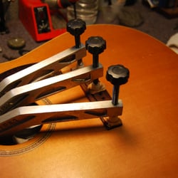 A bridge that was lifted has been removed, glued and clamped