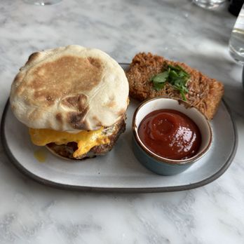 The Shipwright's Daughter - Sausage sandwich with hash brown - Seafood Near Me - Mystic, Connecticut The Shipwright's Daughter - Sausage sandwich with hash brown - Seafood Near Me - Mystic, Connecticut