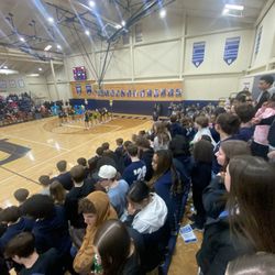 University High School Of Indiana - Students at a basketball senior night.