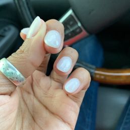 Had an air bubble and technician just scraped with her finger nail and added top clear coat over it.