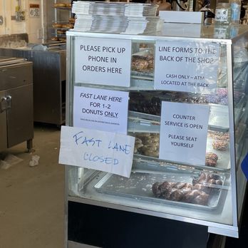 Stan's Donut Shop - Various signs at the entrance - Donuts Near Me - Santa Clara, California Stan's Donut Shop - Various signs at the entrance - Donuts Near Me - Santa Clara, California