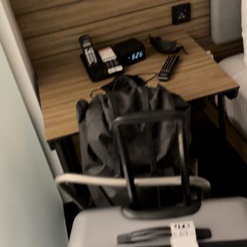 Pod Times Square Hotel - Tiny desk with usb charger in between the restroom and bed. - Hotels Near Me - New York, New York Pod Times Square Hotel - Tiny desk with usb charger in between the restroom and bed. - Hotels Near Me - New York, New York