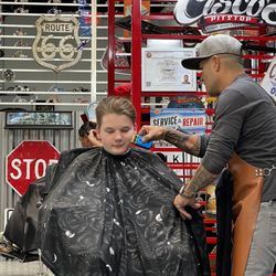 Cisco's Pitstop Barbershop - Even gave him his first shave with Cisco's famous peach fuzz remover!
