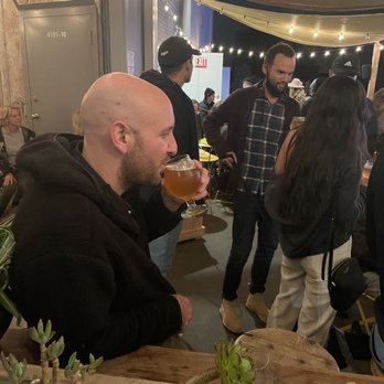 brewLAB - Me sitting on the brew lab side and my husband sitting on the other side - Breweries Near Me - Carpinteria, California