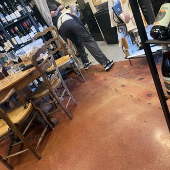 Cailloux Cheese Shop - Staff dropping a fig on the floor and picking it up with bare hands. Then went back and continue to cut the rest of the figs. - Cheese Shops Near Me - Solvang, California