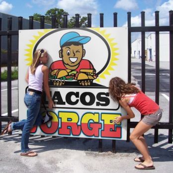 Jorge Tacos - two women leaning against a sign - Tacos Near Me - East Los Angeles, California Jorge Tacos - two women leaning against a sign - Tacos Near Me - East Los Angeles, California