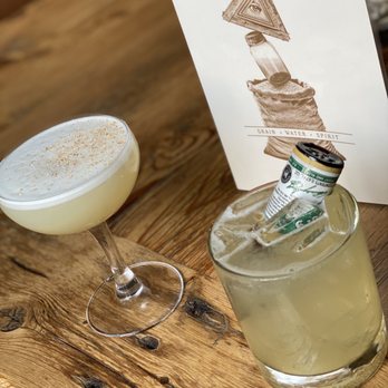 Montgomery Distillery - The Undertaker (drink with bottle) and Rocky Mountain Flip - Bars Near Me - Missoula, Montana