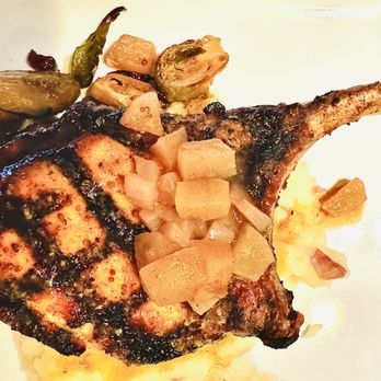 Sage Room - Pork chop with mashed potatoes, brussel sprouts, and cinnamon apples - New American Near Me - Hilton Head Island, South Carolina Sage Room - Pork chop with mashed potatoes, brussel sprouts, and cinnamon apples - New American Near Me - Hilton Head Island, South Carolina