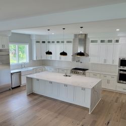 Cabinets and Granite Depot - Large kitchen and an island with waterfall sides