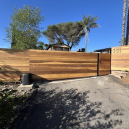 Driveway gate, passenger gate, and two fence panels from the street.