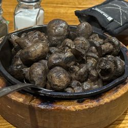 Iowa Beef Steak House - Large skillet of sautéed mushrooms.