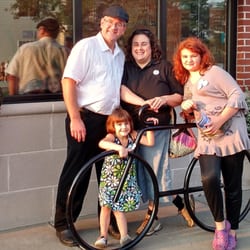 Midtown Sedan - Back: Jeff Berkenpas, Sarah Juneau Front: Justice Berkenpas, Journey Berkenpas Outside of House of Flavors.