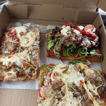 Taglio Pizza - Prosciutto Arugula and San Gennaro slices - both absolutely delicious - Pizza Near Me - Mineola, New York Taglio Pizza - Prosciutto Arugula and San Gennaro slices - both absolutely delicious - Pizza Near Me - Mineola, New York