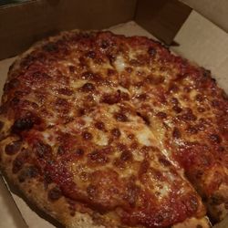 Gorgeous personal cheese pizza, ordered well done the sauce is so rich and delicious! My husband loves the hot wings and fries too