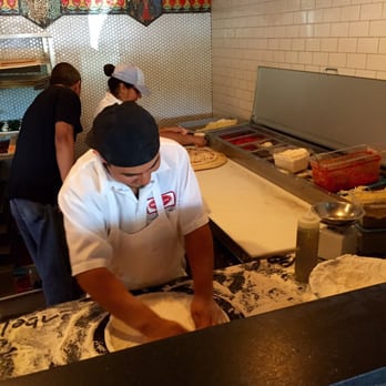 Home Slice Pizza - Making the pizzas - Pizza Near Me - Austin, Texas Home Slice Pizza - Making the pizzas - Pizza Near Me - Austin, Texas