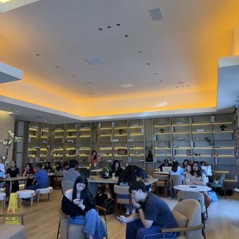 Rang Coffeehouse - Inside neutral looks. A lot of people sitting - Coffee & Tea Near Me - Sacramento, California