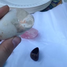 A calcite fairy stone, rose quartz, and tiger's eye