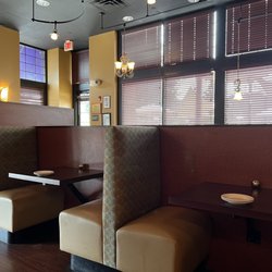 White Orchids Thai Cuisine - Booths are very tight. Uncomfortable. You feel the movement of the person behind you too. It's annoying.