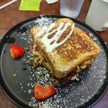 Huevos Etc - All in One Sandwich - French toast sandwich with eggs, bacon, Sausage, cheese, and hash browns - Pancakes Near Me - Indianapolis, Indiana