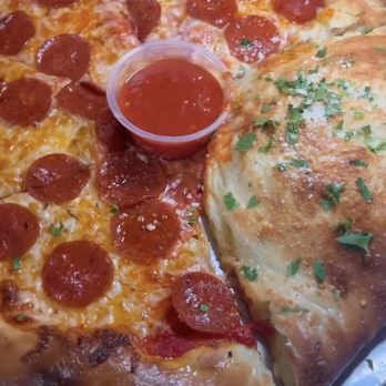 Amano - Half Pizza & Half calzone stuffed with pasta - Pizza Near Me - Las Vegas, Nevada Amano - Half Pizza & Half calzone stuffed with pasta - Pizza Near Me - Las Vegas, Nevada