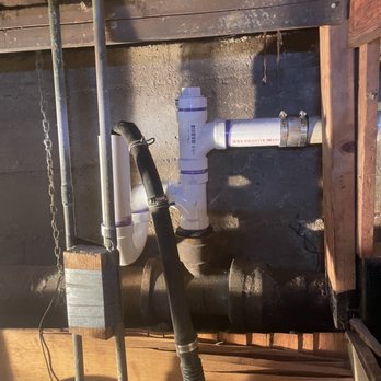 In and Out Sewer - A repaired washing machine trap with a clean out - Plumbing Near Me