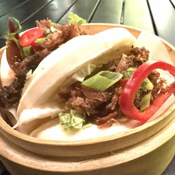 Wagamama - Chili Hoisin Duck Bao Pillowy bao buns filled with rich, sweet-heat duck. Soft, savory, and incredibly satisfying in just a few bites. - Asian Fusion Near Me - Tampa, Florida Wagamama - Chili Hoisin Duck Bao Pillowy bao buns filled with rich, sweet-heat duck. Soft, savory, and incredibly satisfying in just a few bites. - Asian Fusion Near Me - Tampa, Florida