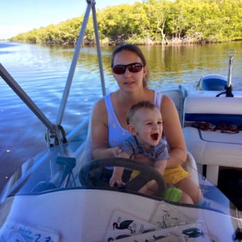 Manatee Sightseeing and Wildlife Adventures - Our son "driving" the boat - Boat Tours Near Me - Naples, Florida Manatee Sightseeing and Wildlife Adventures - Our son "driving" the boat - Boat Tours Near Me - Naples, Florida