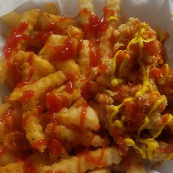 Crabman 305 Miami - Conch and fries ready to go with ketchup,  mustard,  and hit sauce. - Seafood Near Me - Opa-locka, Florida