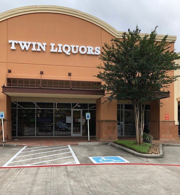 Twin Liquors #97 - Woodlands Indian Springs Logo